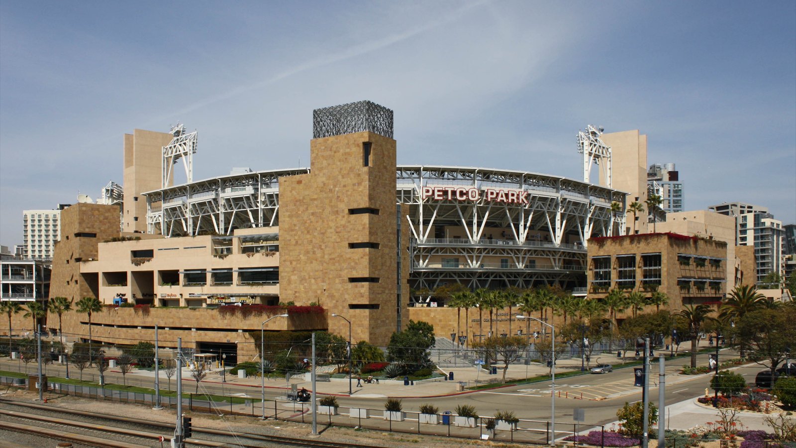 Petco Park baseball stadium beneath a blue sky in downtown San Diego.