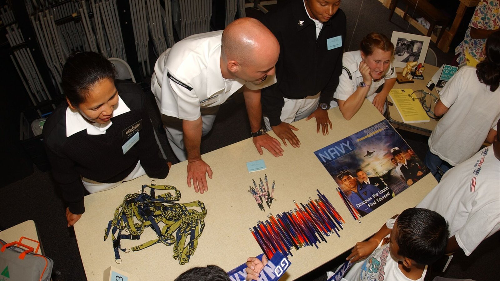 San Diego, Calif. (June 22, 2004) - Sailors from Commander Cruiser Destroyer Group Five (CCDG-5) answer questions about the Navy from students at the Valencia Park Center for Academics Drama and Dance, during the 6th…