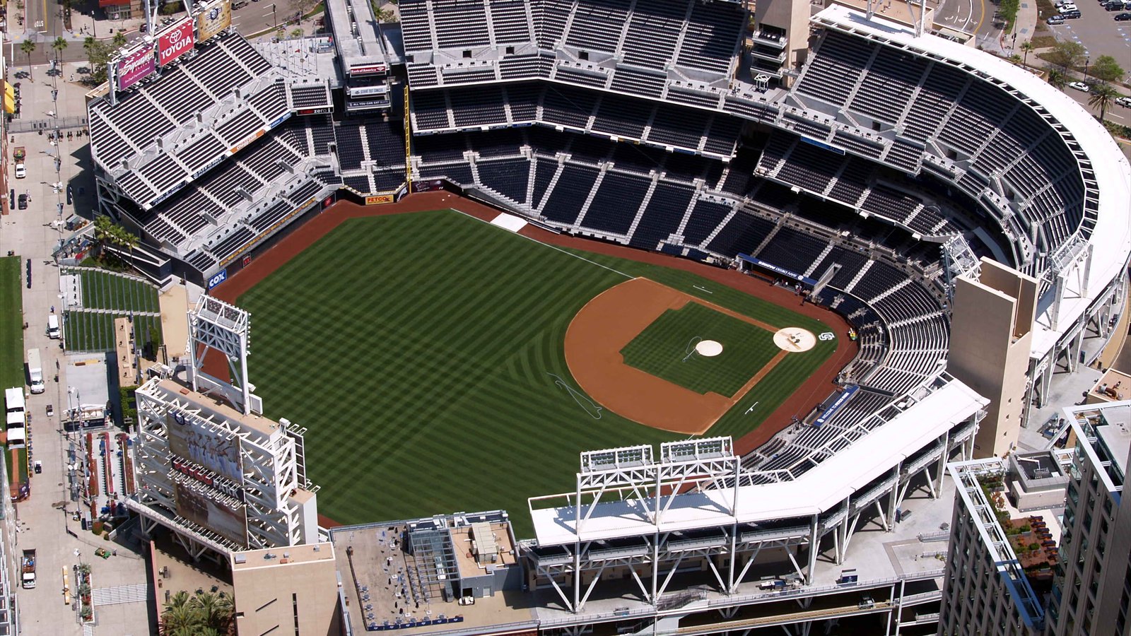 Aerial view of Petco Park and surrounding downtown San Diego buildings.