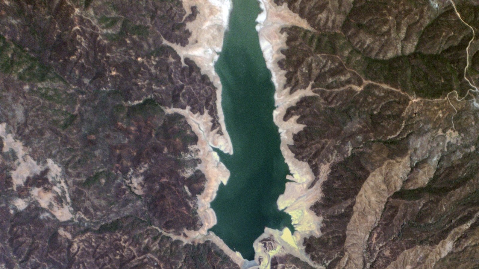 Indian Valley Reservoir, California USA - Planet Labs satellite image. The effects of California’s drought become quite apparent in this image of a reservoir in Lake County, which supplies water to nearby Yolo County…