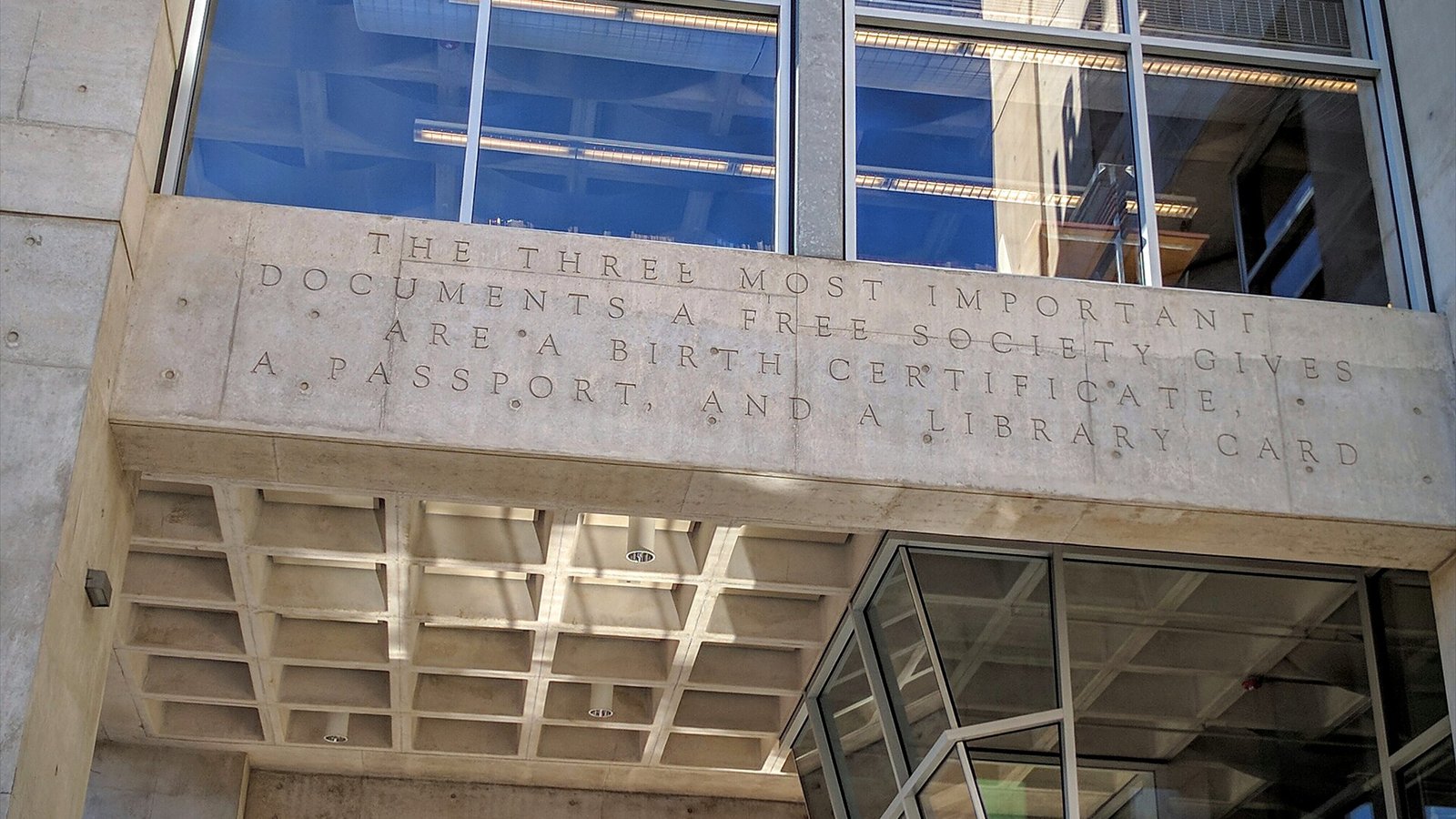 Wall of San Diego Central Library with quote: "the three most important documents a free society gives are a birth certificate, a passport, and a library card"