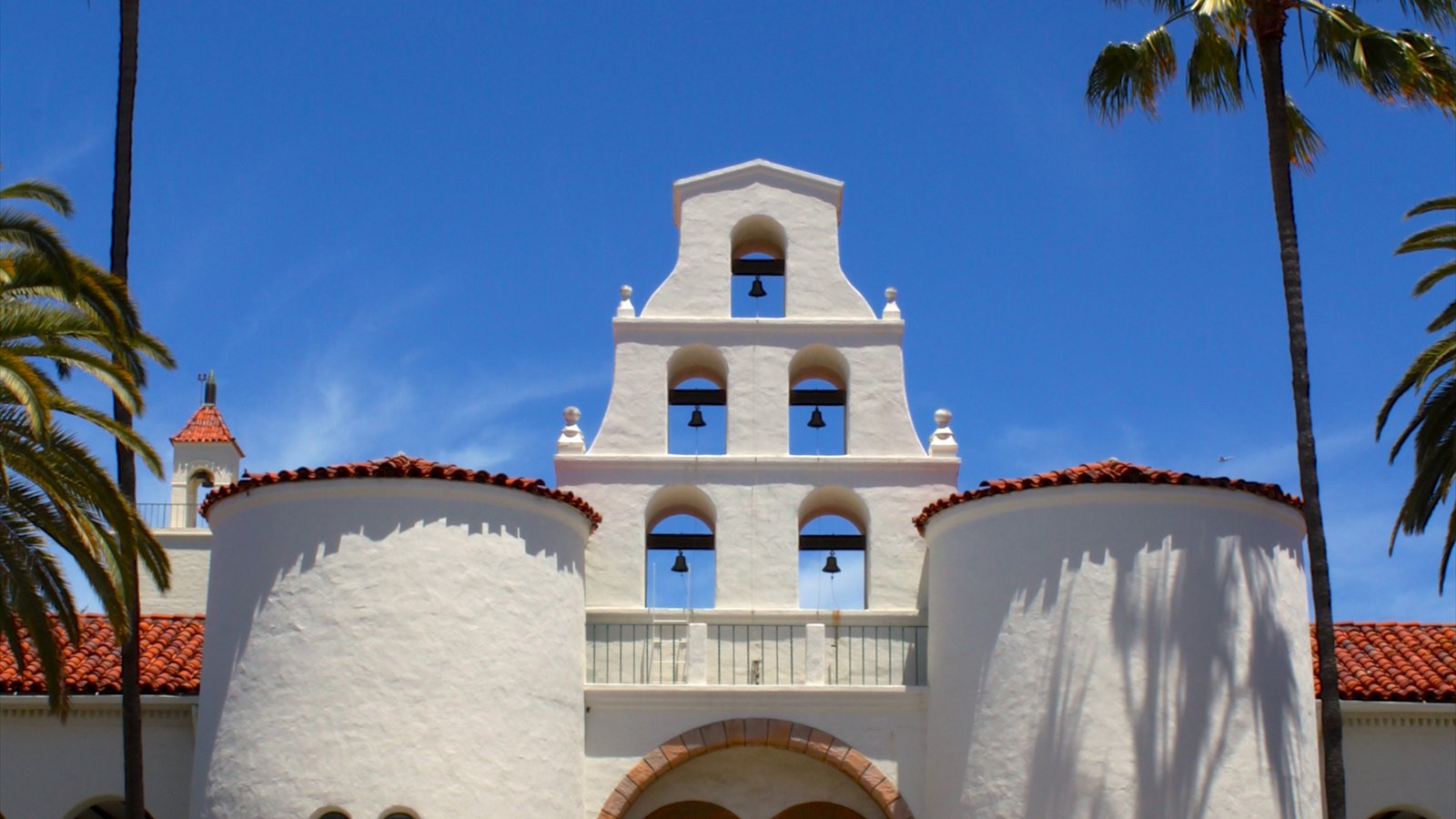 Twin bell towers frame the arched entrance of Hepner Hall on the San Diego State University campus.