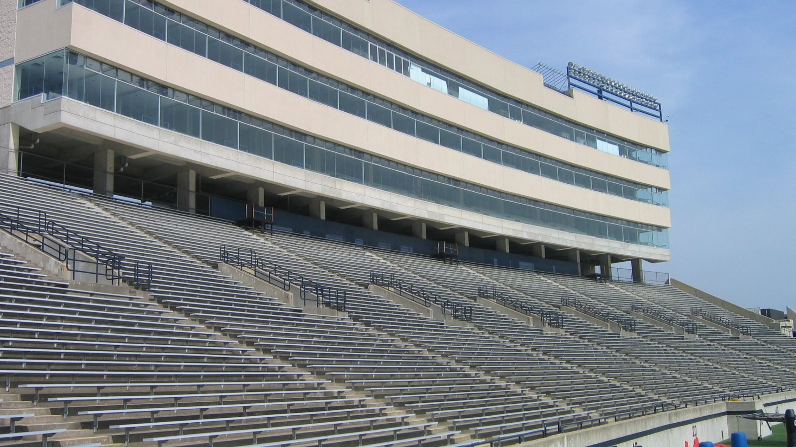 The football field and tiered stands of Toledo's Glass Bowl sit beneath a cloudy sky.