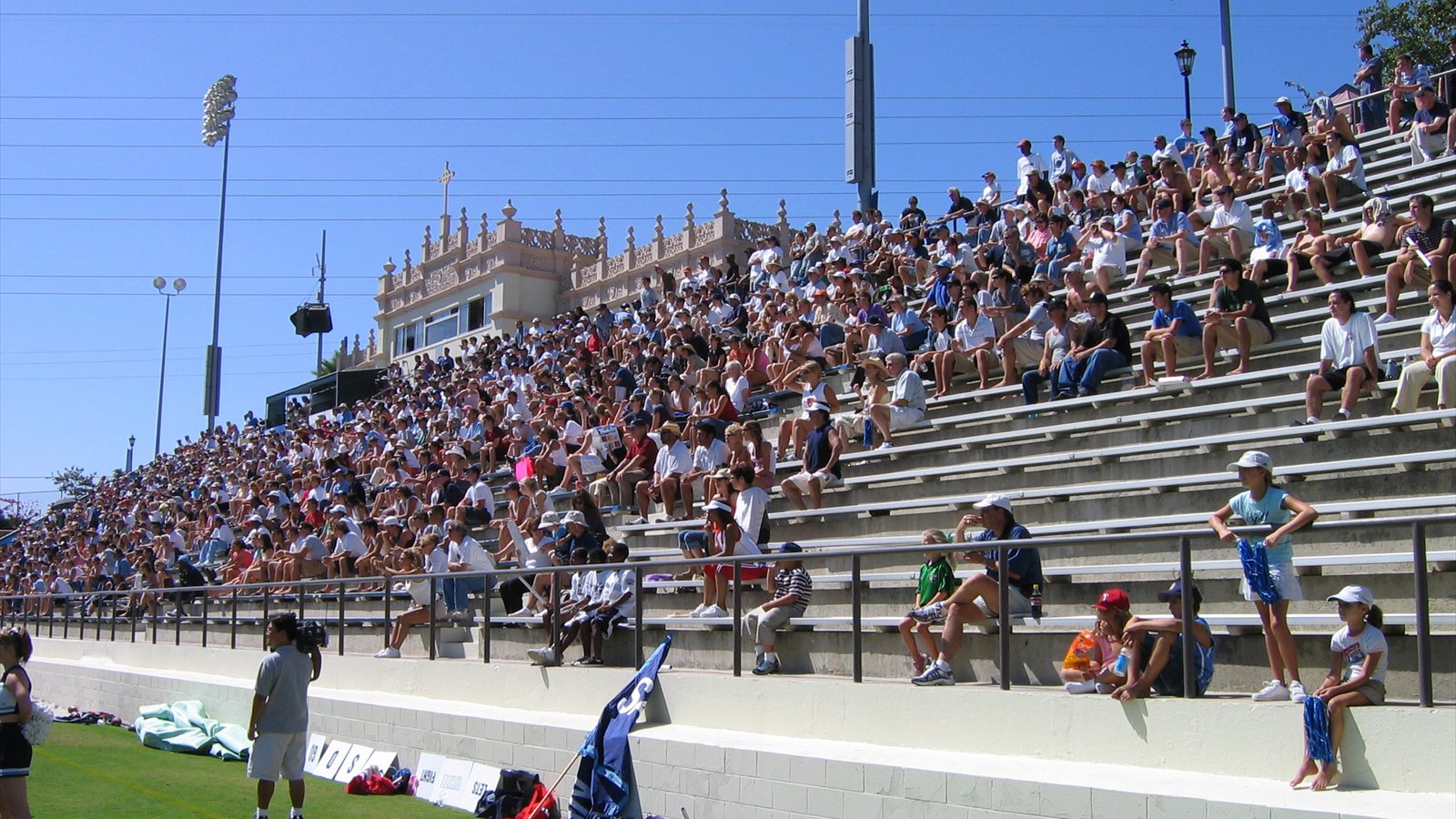 Crowded concrete grandstands and a press box overlook the field at Torero Stadium in San Diego.